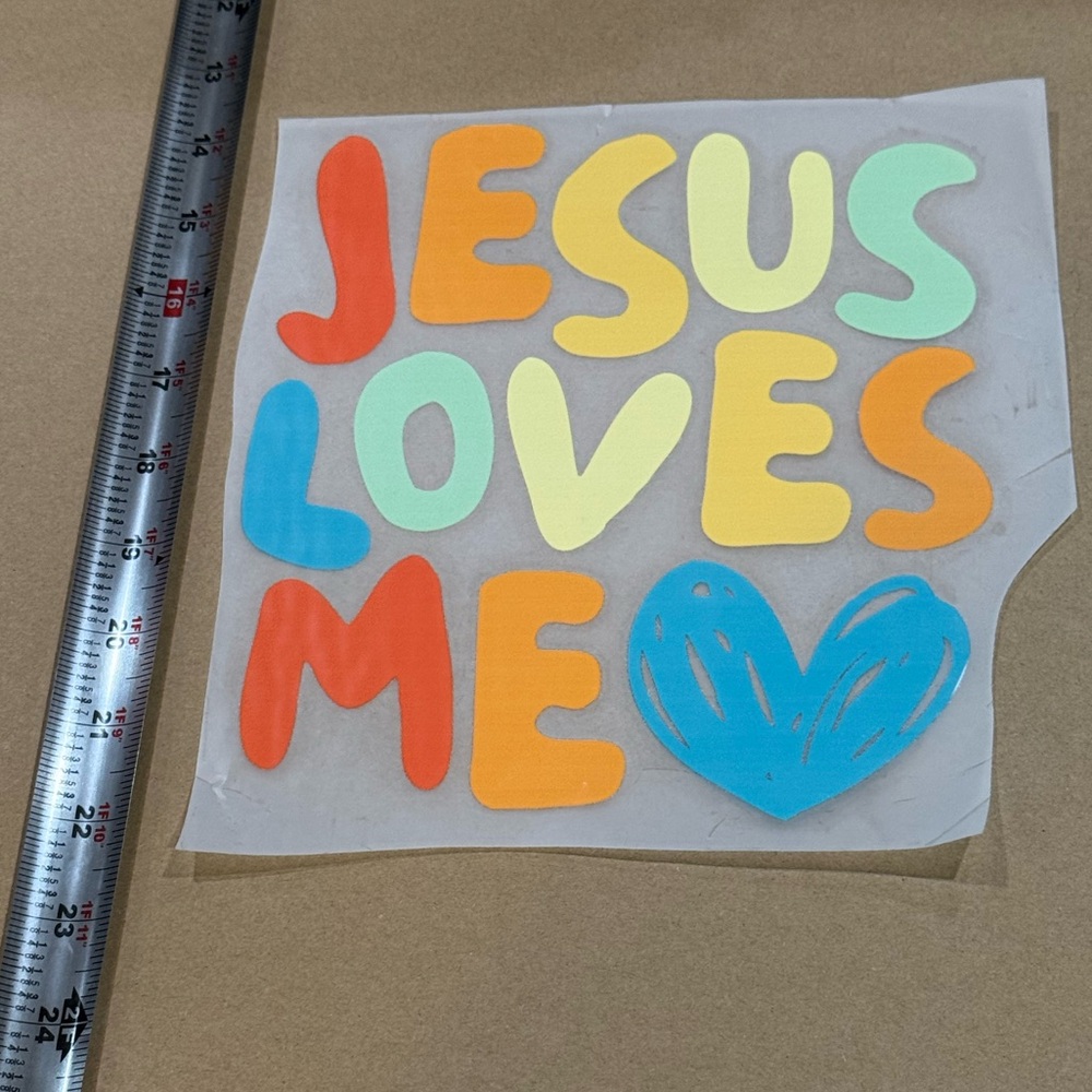 Colorful 'Jesus Loves Me' DTF transfer